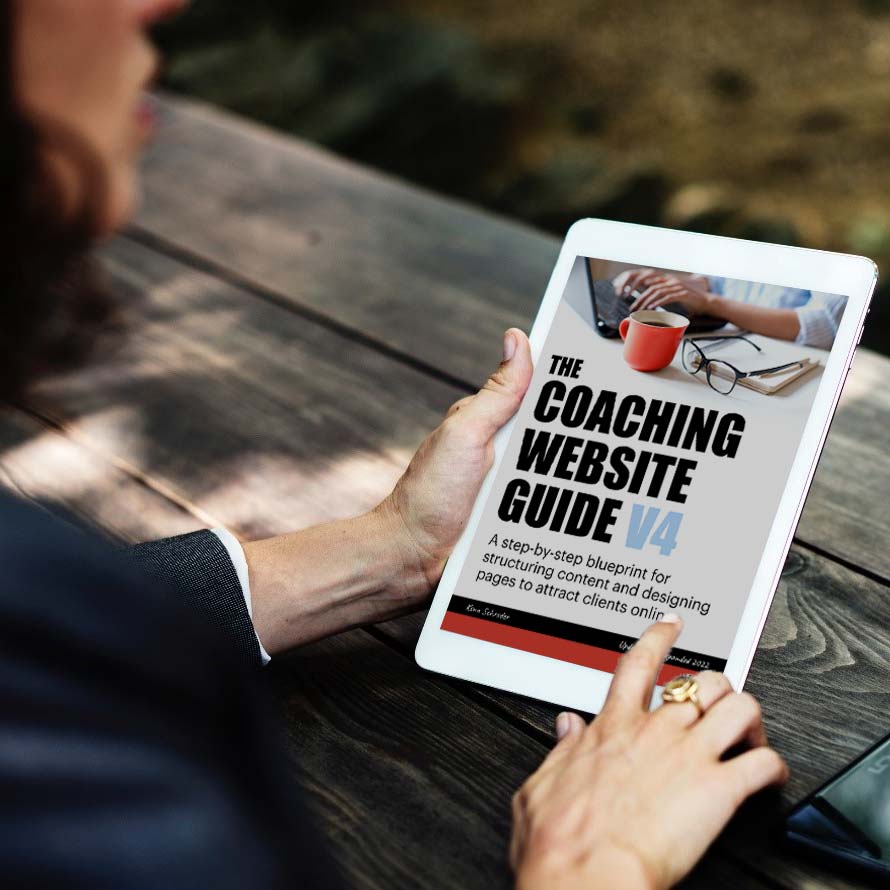 woman looking at the coaching website guide on ipad